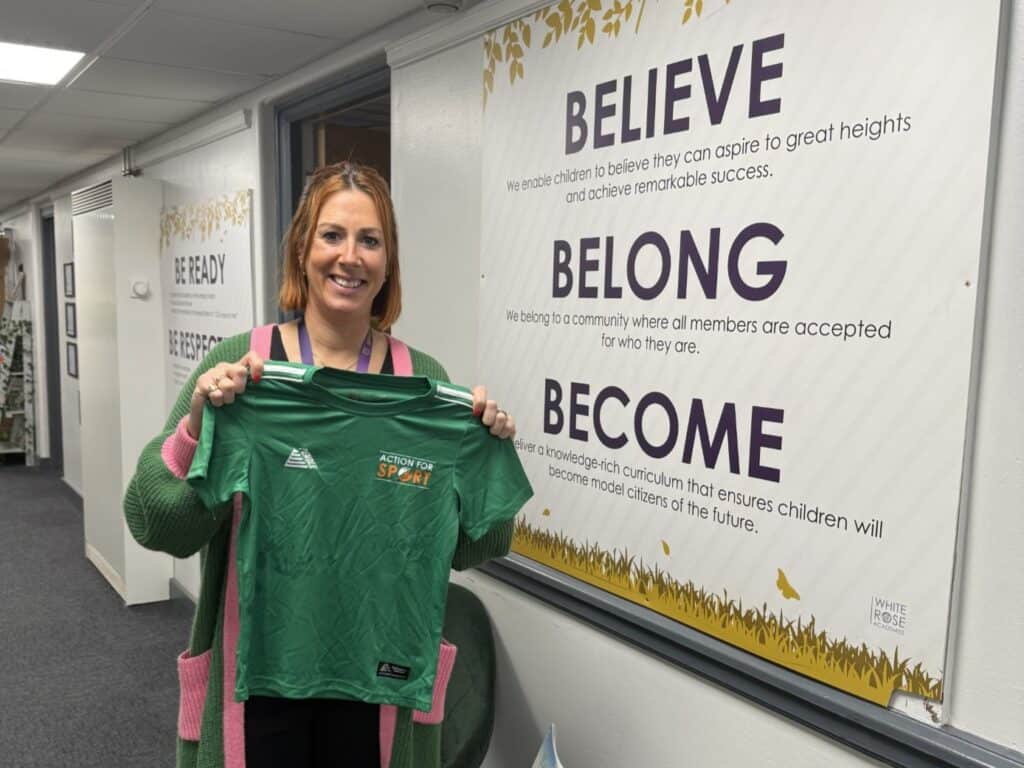 Alder Tree Primary Academy Leeds, Principal Mrs Kate Burton holding some of the kit donated by Action For Sport